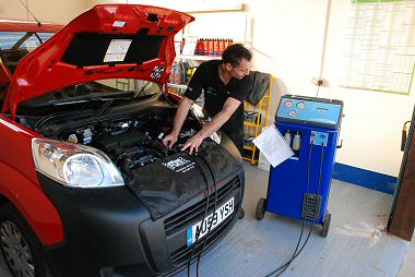 Paul works on the Air Conditioning system of a car in the Air Con Workshop 
